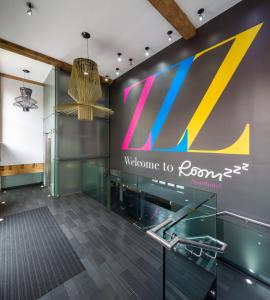 a lobby with a welcome to room sign at Roomzzz Manchester City in Manchester