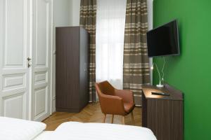 Telewizja i/lub zestaw kina domowego w obiekcie Vienna Stay Apartments Castellez 1020