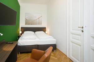 Łóżko lub łóżka w pokoju w obiekcie Vienna Stay Apartments Castellez 1020