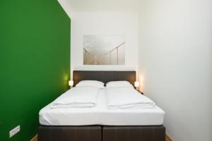 Łóżko lub łóżka w pokoju w obiekcie Vienna Stay Apartments Castellez 1020