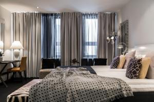 Ένα ή περισσότερα κρεβάτια σε δωμάτιο στο Hotel Fabian