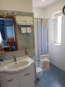 Vannituba majutusasutuses Hotel L'Isola