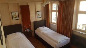 Postel nebo postele na pokoji v ubytování Hotel-Restaurant Goldenes Lamm