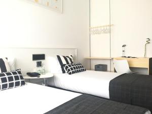 Postel nebo postele na pokoji v ubytování Hotel Umu