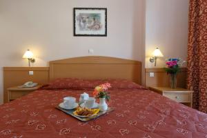 Кровать или кровати в номере Hotel Tolo
