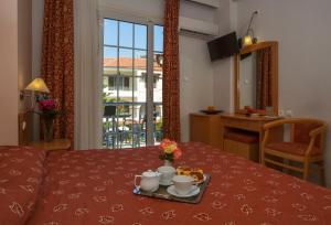 Кровать или кровати в номере Hotel Tolo
