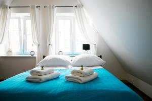 Posteľ alebo postele v izbe v ubytovaní H&T Old Town Szeroka 77