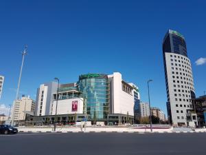 a city with tall buildings and a car on a street at Apartamento Ciencias y Playa in Valencia