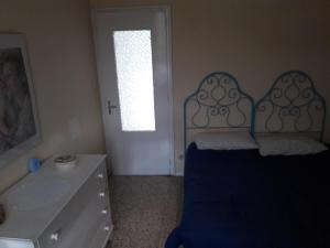 Tempat tidur dalam kamar di Appartamento in villa