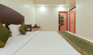 Postel nebo postele na pokoji v ubytování Itsy Hotels Hill View Ex