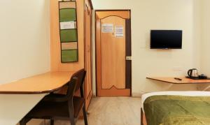 TV a/nebo společenská místnost v ubytování Itsy Hotels Hill View Ex