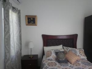 Кровать или кровати в номере Tavalero Rooms