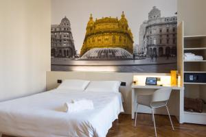 a bedroom with a bed and a picture of a building at B&B Hotel Genova in Genoa