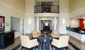 a waiting room at a hospital with chairs and a table at Extended Stay America Suites - Dallas - Las Colinas - Green Park Dr in Irving