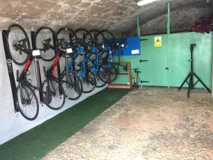 a group of bikes hanging on a wall at "Son Cleda" House Boutique, adults only in Sineu