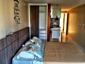 a bedroom with a large bed in a room at Victory Flat Intermares in Cabedelo