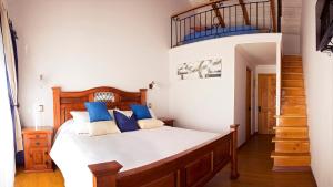 מיטה או מיטות בחדר ב-La Perla Hotel