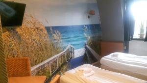 Ένα ή περισσότερα κρεβάτια σε δωμάτιο στο Hotel Velsen