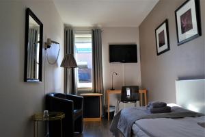 Postel nebo postele na pokoji v ubytování Solsta Hotell