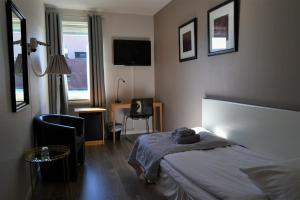 Postel nebo postele na pokoji v ubytování Solsta Hotell