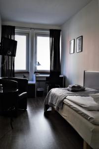 Postel nebo postele na pokoji v ubytování Solsta Hotell