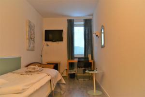TV a/nebo společenská místnost v ubytování Solsta Hotell