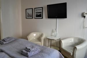 Postel nebo postele na pokoji v ubytování Solsta Hotell