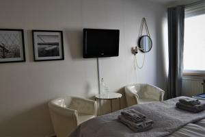 Postel nebo postele na pokoji v ubytování Solsta Hotell
