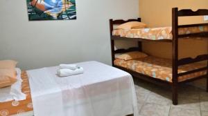 Postel nebo postele na pokoji v ubytování Pousada da Rose Paraty