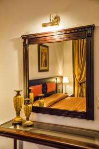Postel nebo postele na pokoji v ubytování Kouros Hotel