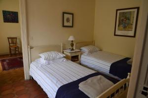 Ein Bett oder Betten in einem Zimmer der Unterkunft Gîte Wistéria