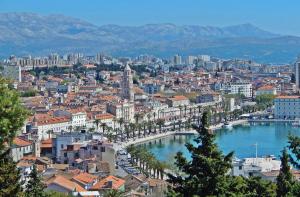 a view of a city with a river and buildings at Apartments Emi in Split