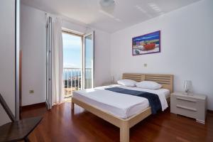 Postel nebo postele na pokoji v ubytování Apartments Ranieri Kono