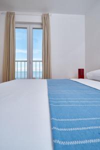 Postel nebo postele na pokoji v ubytování Apartments Ranieri Kono