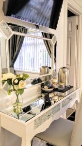 a kitchen with a counter with pots and pans at Number 4 in Derry Londonderry +15 photos