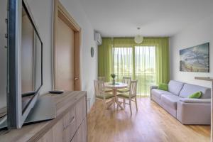 a living room with a couch and a table at Apartments LORA Bokeljske brigade in Budva