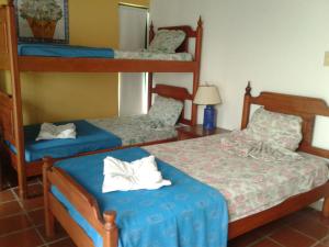 Postel nebo postele na pokoji v ubytování Hotel Villa Paz