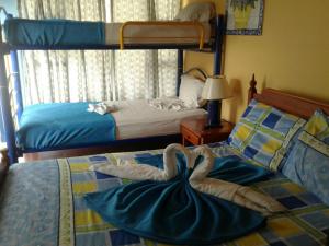 Postel nebo postele na pokoji v ubytování Hotel Villa Paz