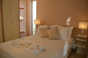 Postel nebo postele na pokoji v ubytování ChaniaStay Central Apartments + 68 fotografií