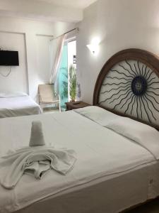 Postel nebo postele na pokoji v ubytování Condo Mar Arena + 71 fotografií