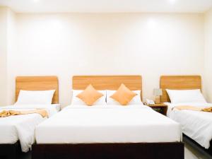 Postel nebo postele na pokoji v ubytování Rublin Hotel Cebu