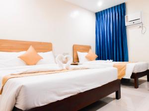 Postel nebo postele na pokoji v ubytování Rublin Hotel Cebu