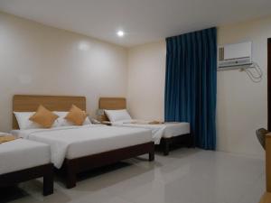 Postel nebo postele na pokoji v ubytování Rublin Hotel Cebu + 35 fotografií