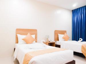 Postel nebo postele na pokoji v ubytování Rublin Hotel Cebu