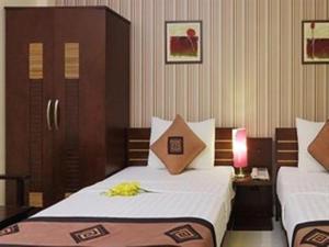 Postel nebo postele na pokoji v ubytování Sen Sai Gon Hotel - Ben Thanh Market