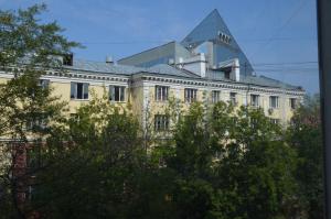 a building with a glass pyramid on top of it at Ulanskaya Hotel in Moscow