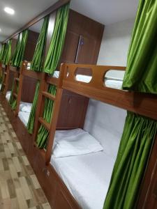 a row of bunk beds on a boat at Royal Dormitory in Mumbai