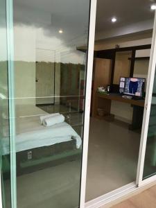 Postel nebo postele na pokoji v ubytování AP Grand Residence