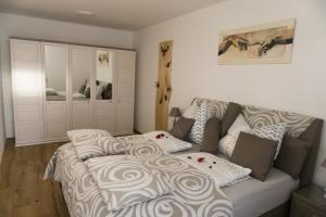 Ein Bett oder Betten in einem Zimmer der Unterkunft Apartment Villa Rigoletto