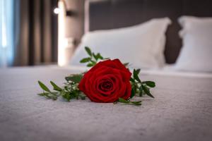 A bed or beds in a room at Blu Notte Guest House